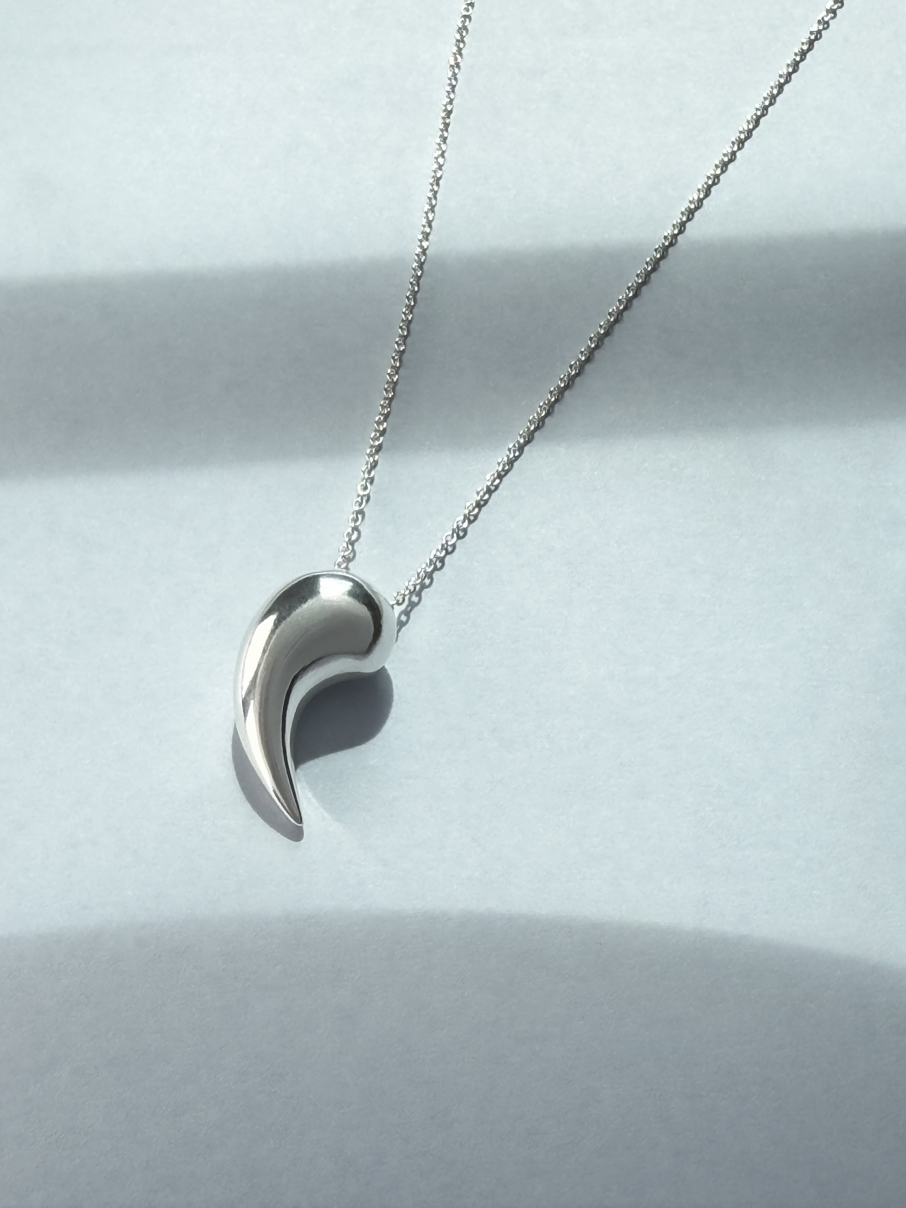 Breathe sculptural pendant in recycled silver by Sara Robertsson Jewellery