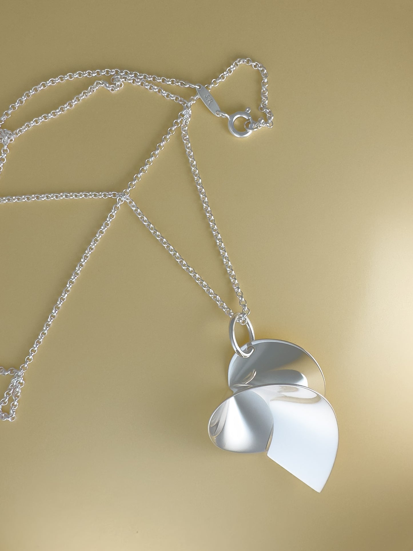 Coil pendant on chain by Sara Robertsson Jewellery