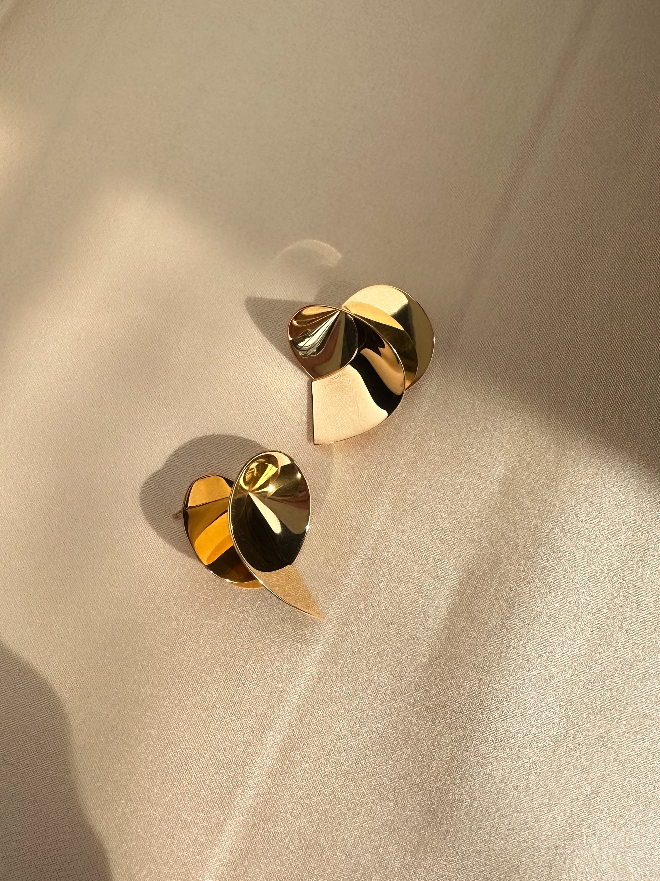 Coil sculptural handmade contemporary earrings in gold vermeil by Sara Robertsson Jewellery