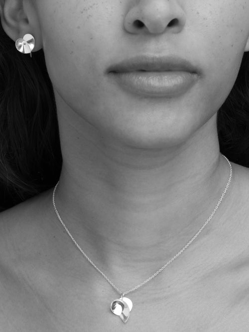 Coil II sculptural handmade earrings in gold vermeil by Sara Robertsson Jewellery. Made in Europe.