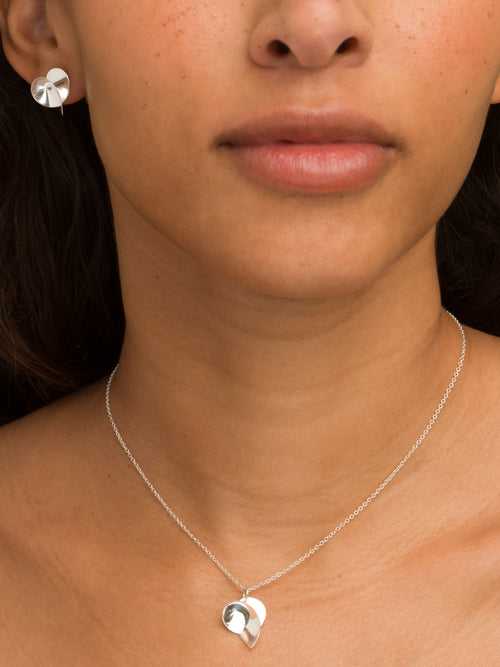 Coil II sculptural handmade earrings in recycled sterling silver by Sara Robertsson Jewellery