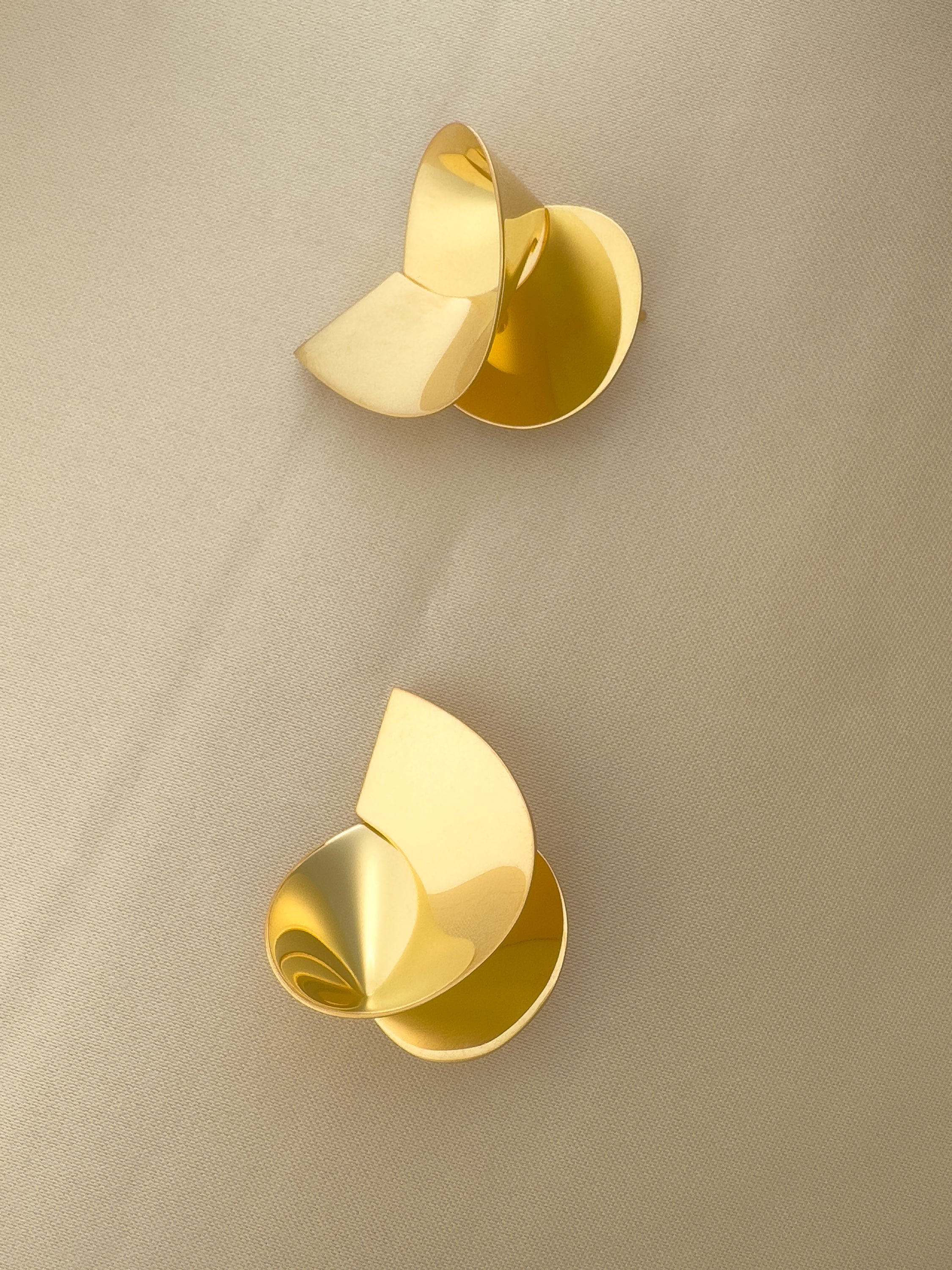 Coil sculptural handmade poetic earrings in gold vermeil by Sara Robertsson Jewellery