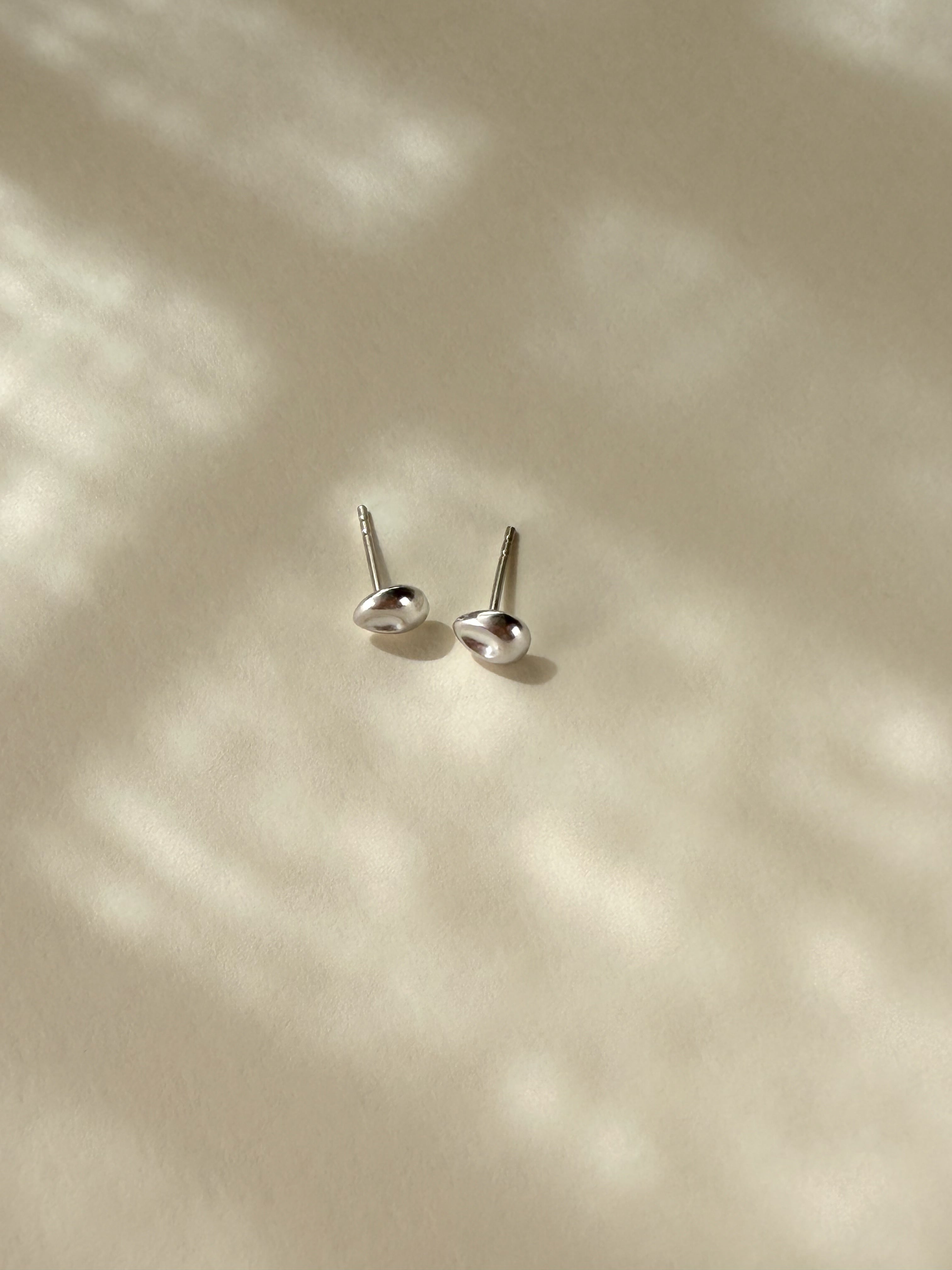 Pebble Stud Earrings in recycled sterling silver showing front and back view.
