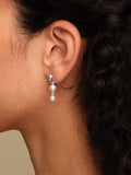 Pendant Earrings with freshwater pearl pendants by Sara Robertsson Jewellery on model.