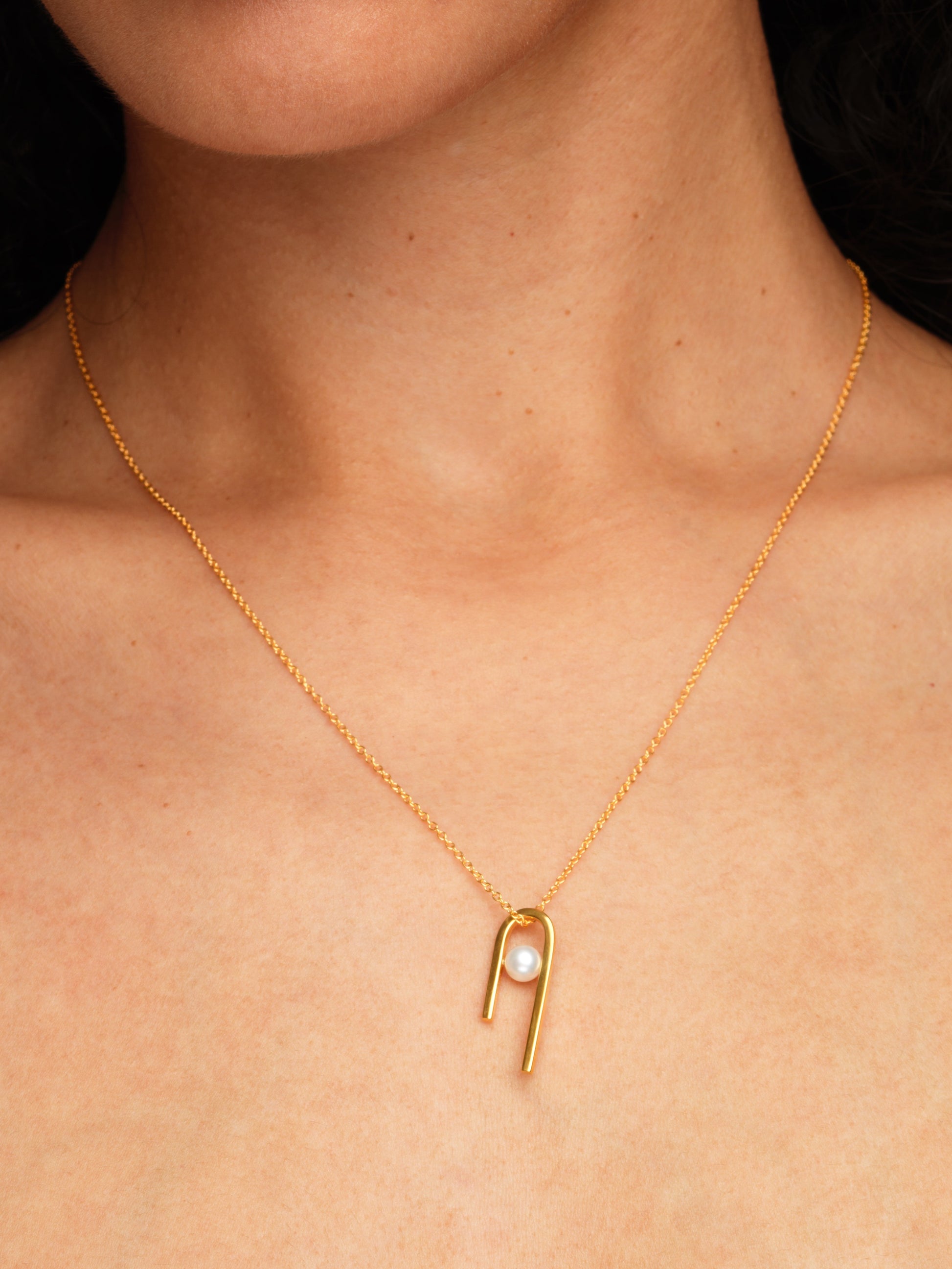 String pendant in gold vermeil with freshwater pearl by Sara Robertsson Jewellery