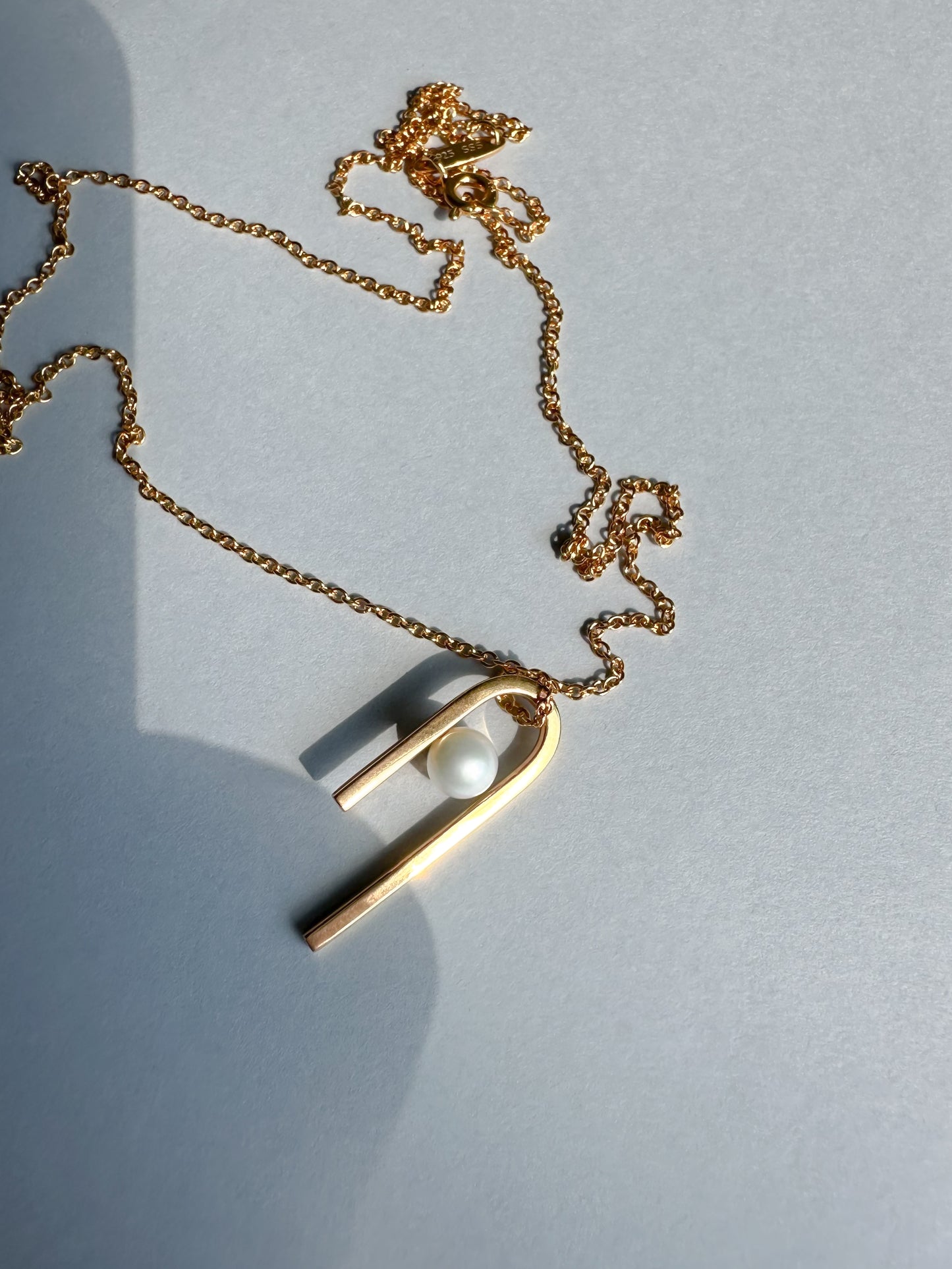 String pendant in gold vermeil with freshwater pearl by Sara Robertsson Jewellery