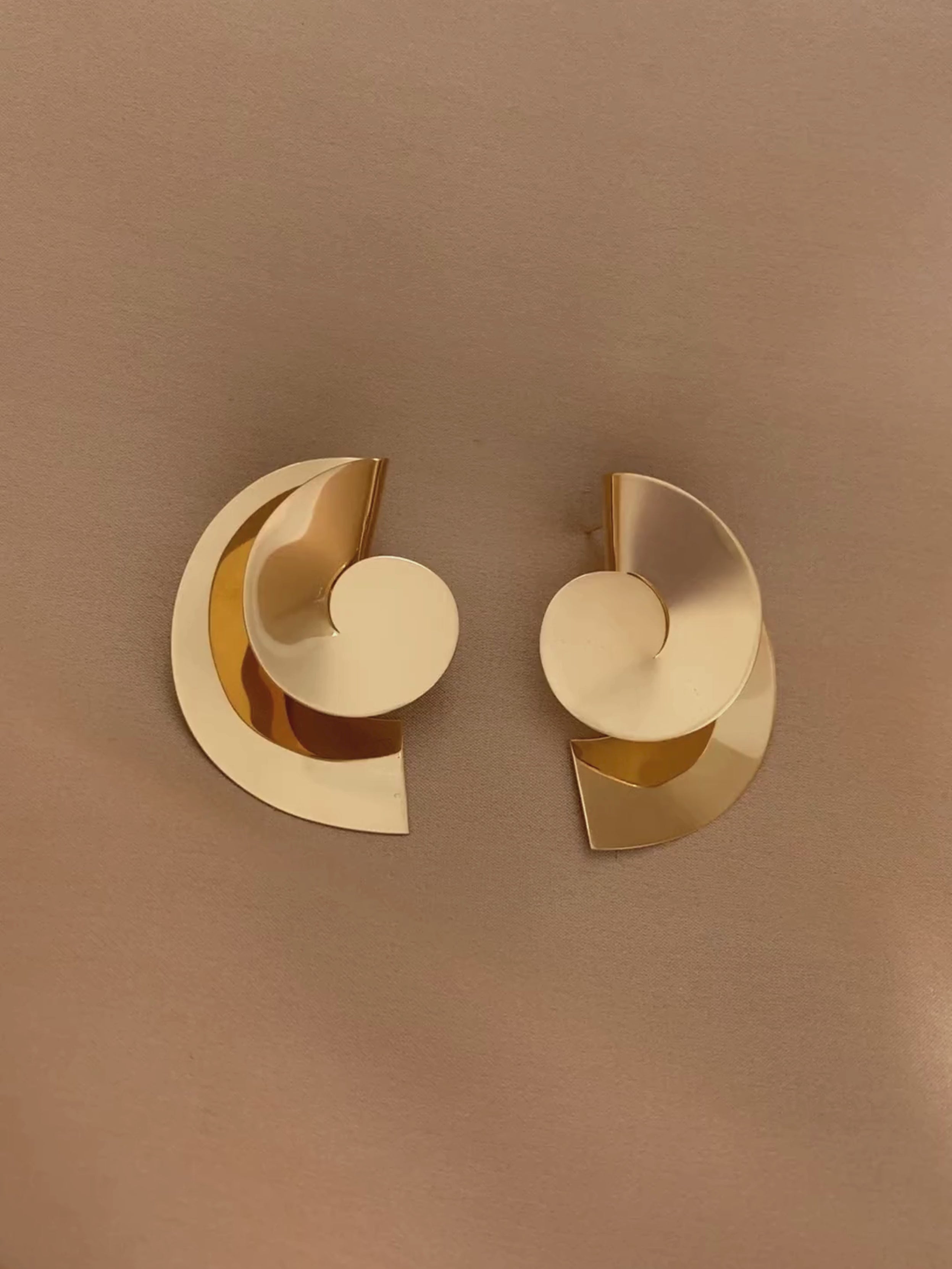 Sun II sculptural handmade and unique earrings in gold by Sara Robertsson Jewellery still video
