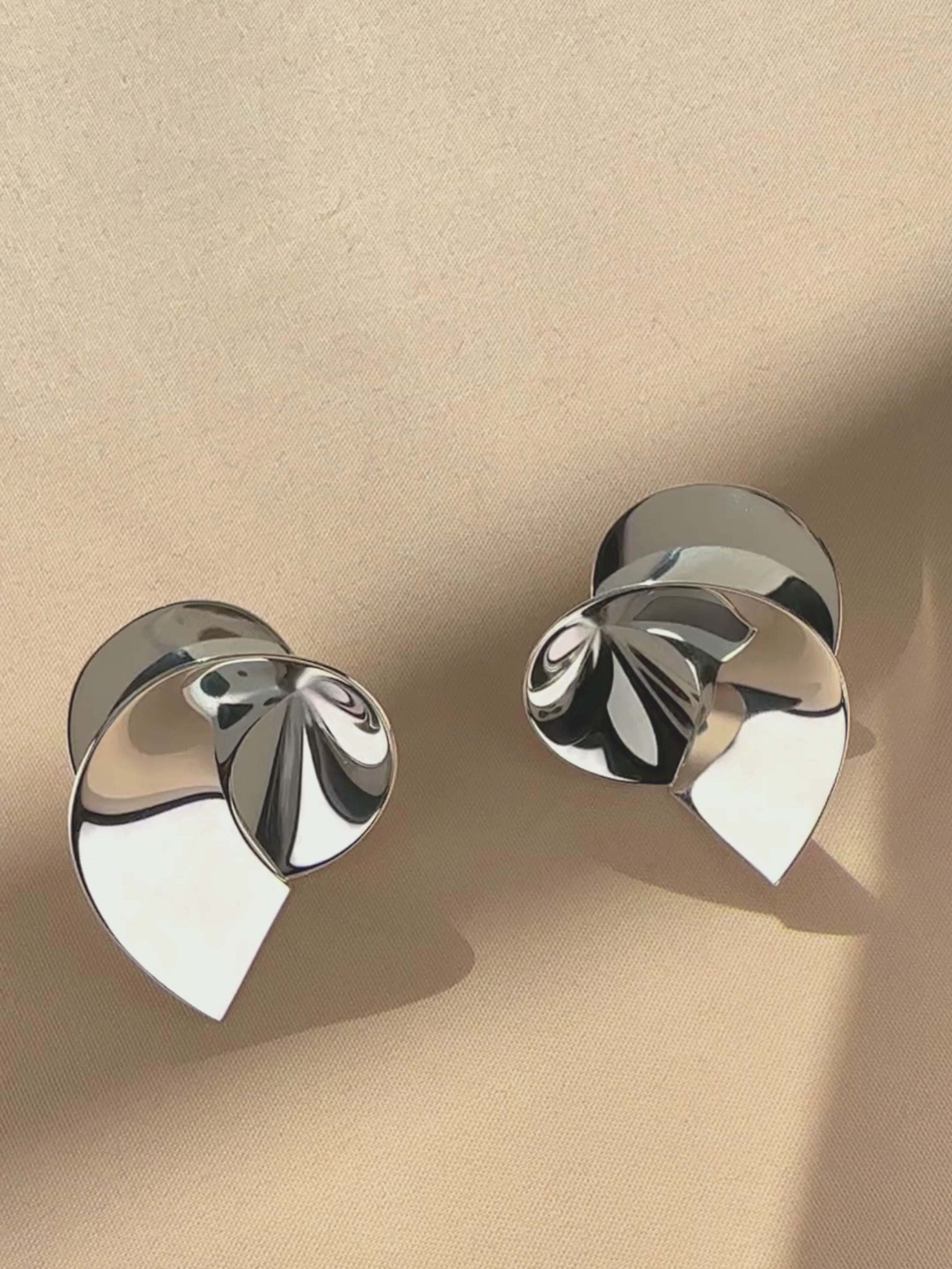 Coil sculptural earrings by Sara Robertsson Jewellery video 01