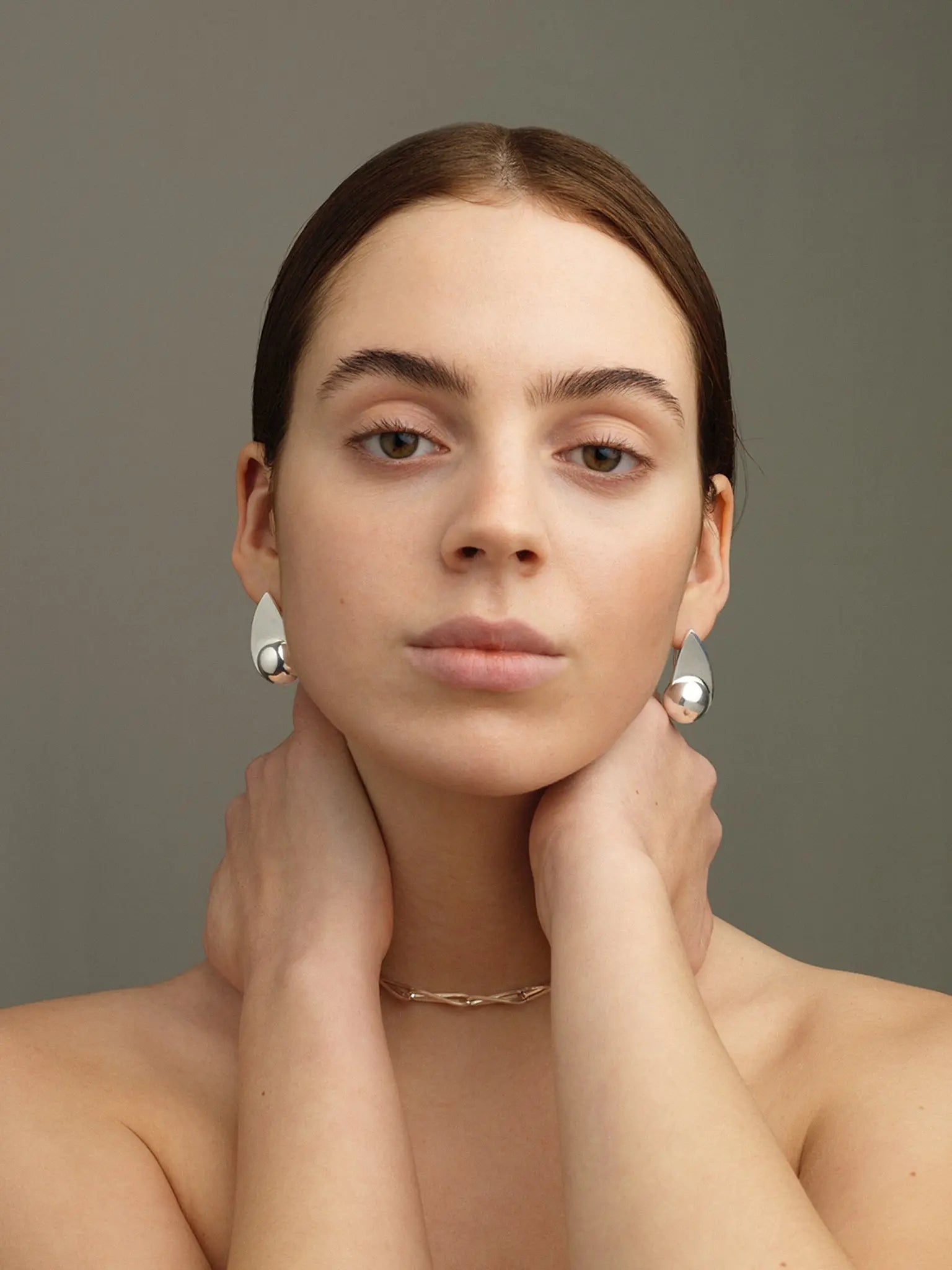 Spring sculptural polished Earrings In Silver Sara Robertsson Jewellery. Made in Sweden.